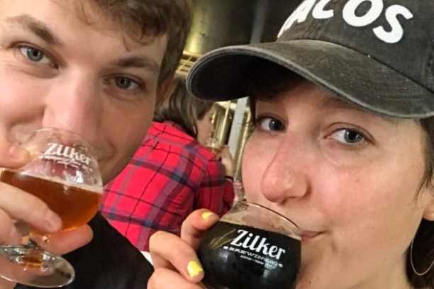 a close up of a person drinking from a glass