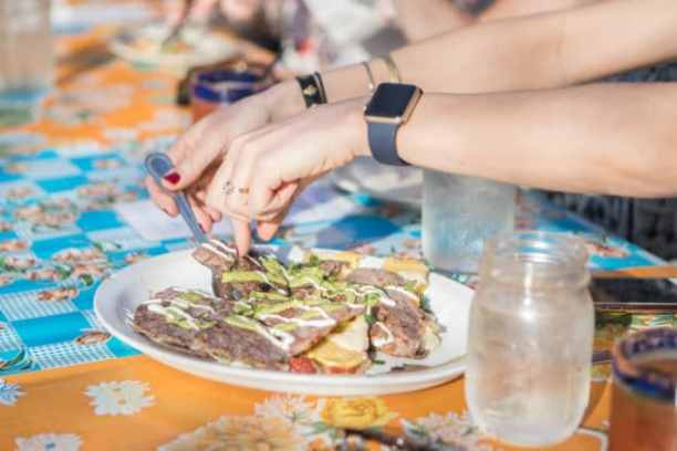 a person sitting at a table with food