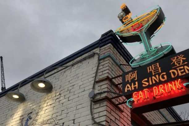 a clock hanging from the side of a building