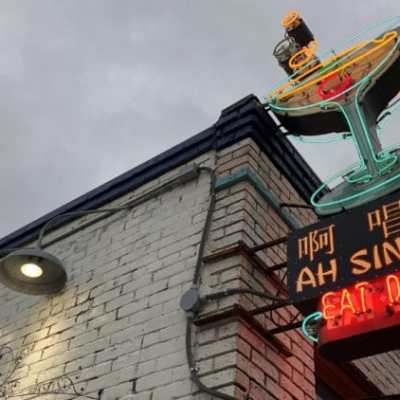 a clock hanging from the side of a building