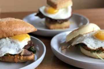a breakfast sandwich on a plate