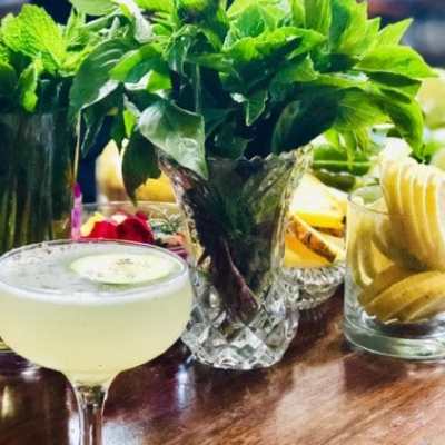 a table topped with plates of food and glasses of wine