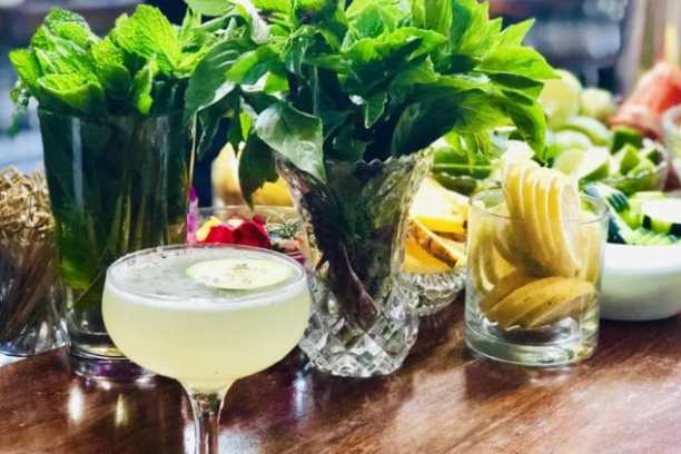 a table topped with plates of food and glasses of wine