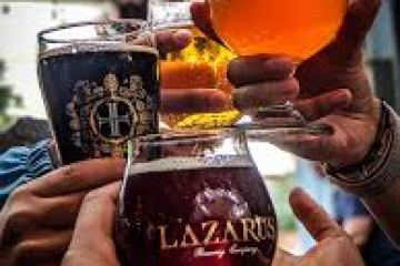 a hand holding a glass of orange juice