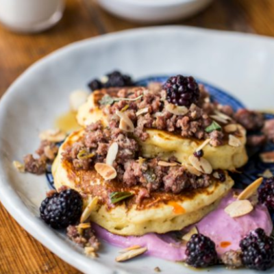 a plate of food and a cup of coffee