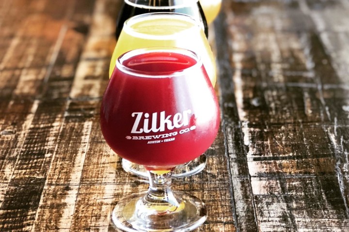 a close up of a glass of beer on a table